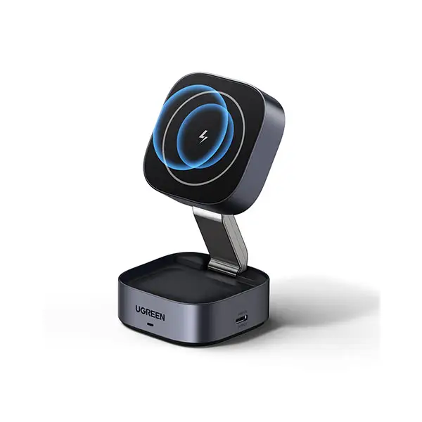 A metallic grey UGREEN foldable magnetic wireless charging stand featuring an adjustable tilted charging pad for a smartphone and a secondary charging base for earbuds.